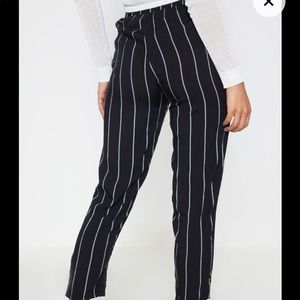 PRETTY LITTLE THING: Black pin stripe trousers